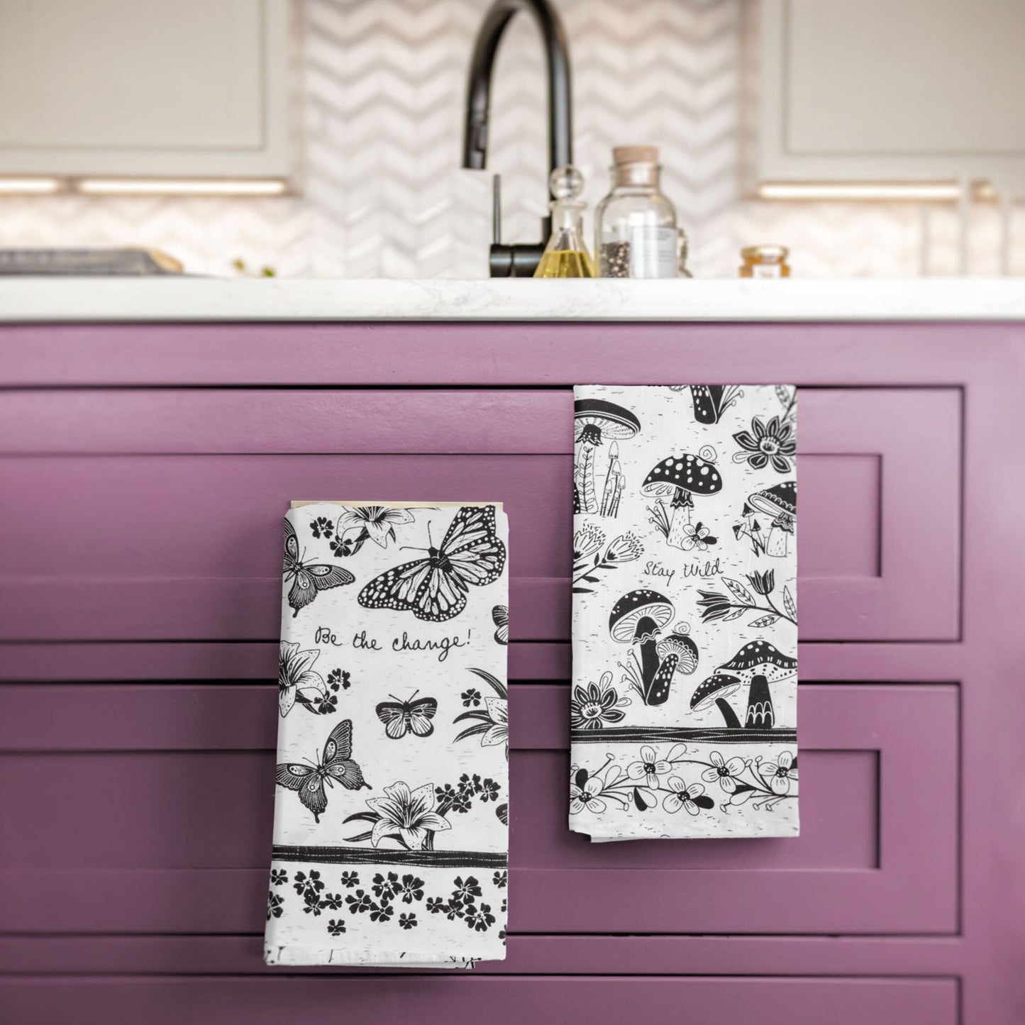 Boho tea towels hanging by a kitchen sink