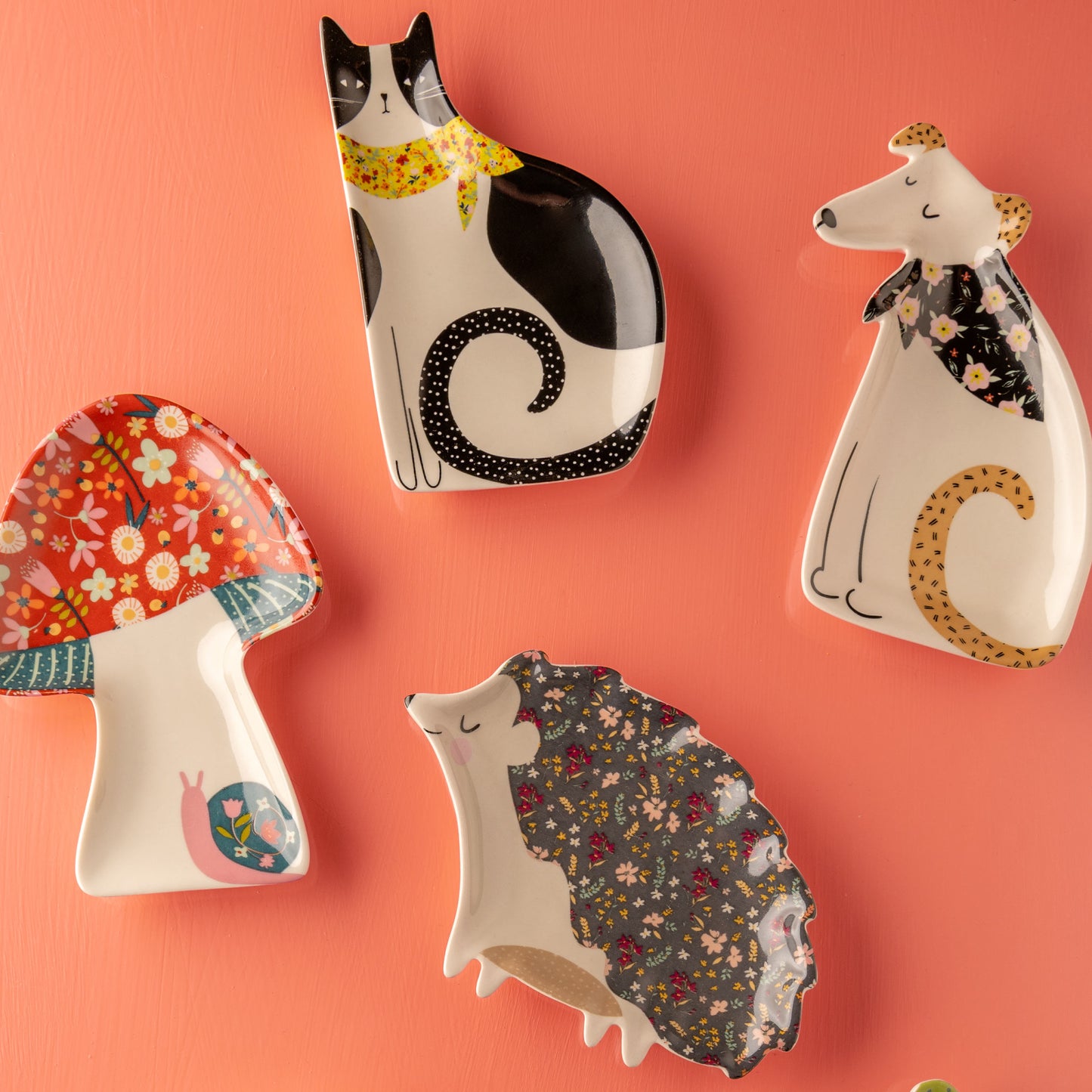 Calico trinket trays with pink background.