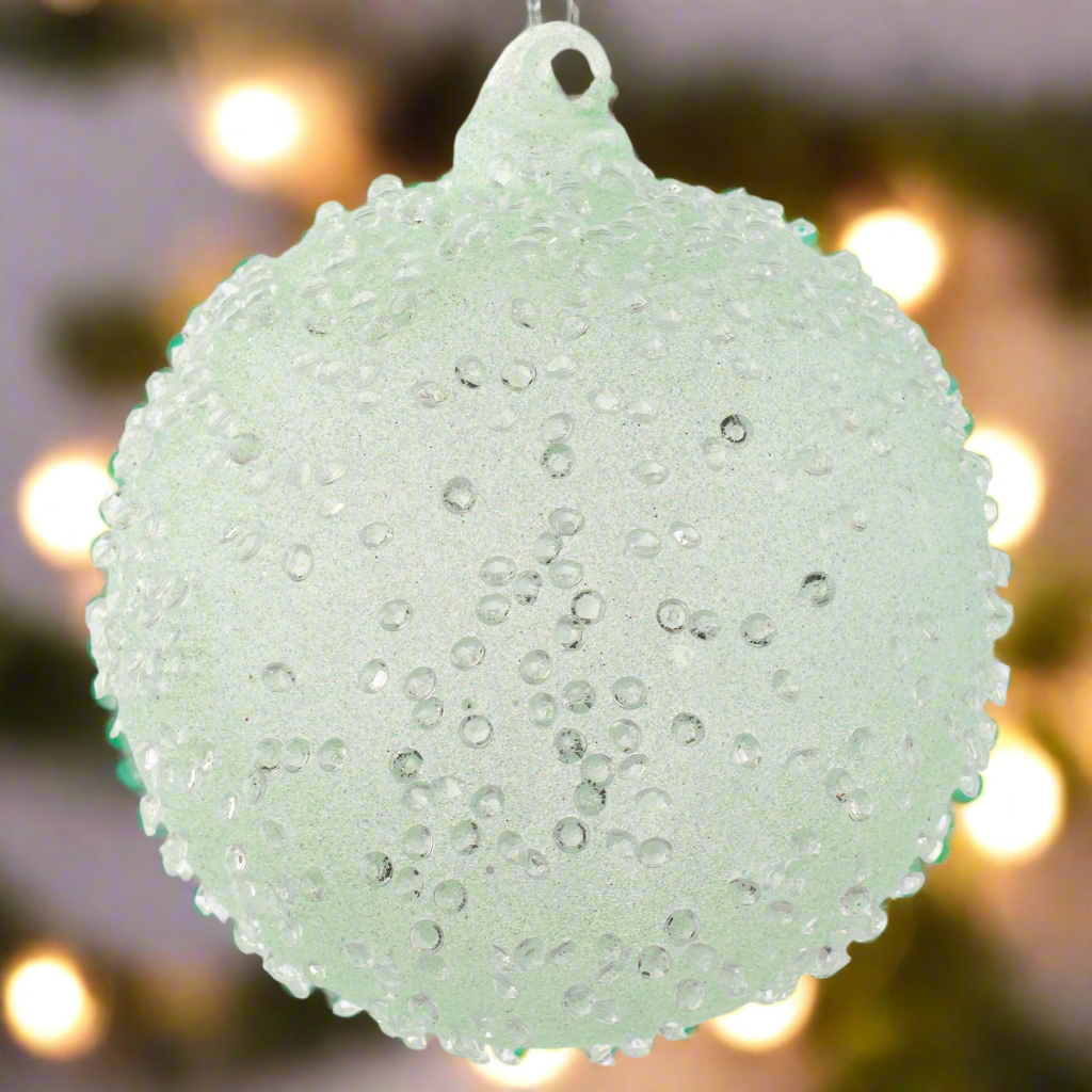 Teardrop Crystal Beaded Glass Ornament Mint with holiday lighting in background.