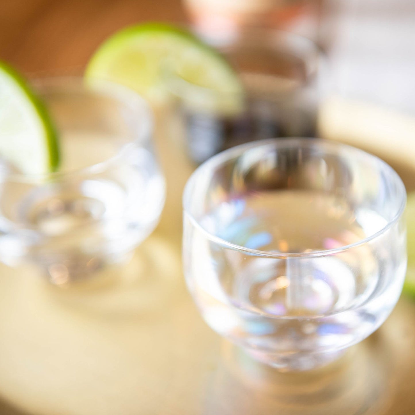 Clear Lexi Collection Shot Glass on a table.