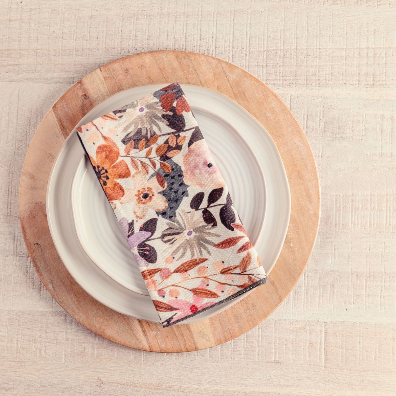 Cinnamon Linen Blend Dinner Napkins on a plate.