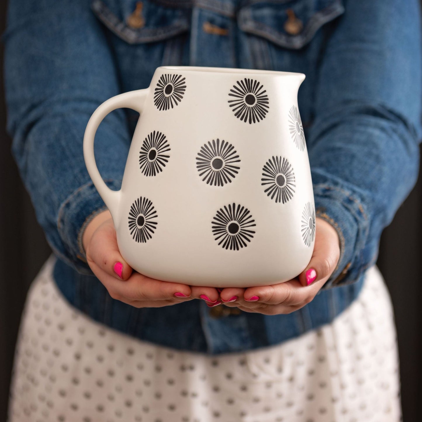 Milo Pitcher being held.