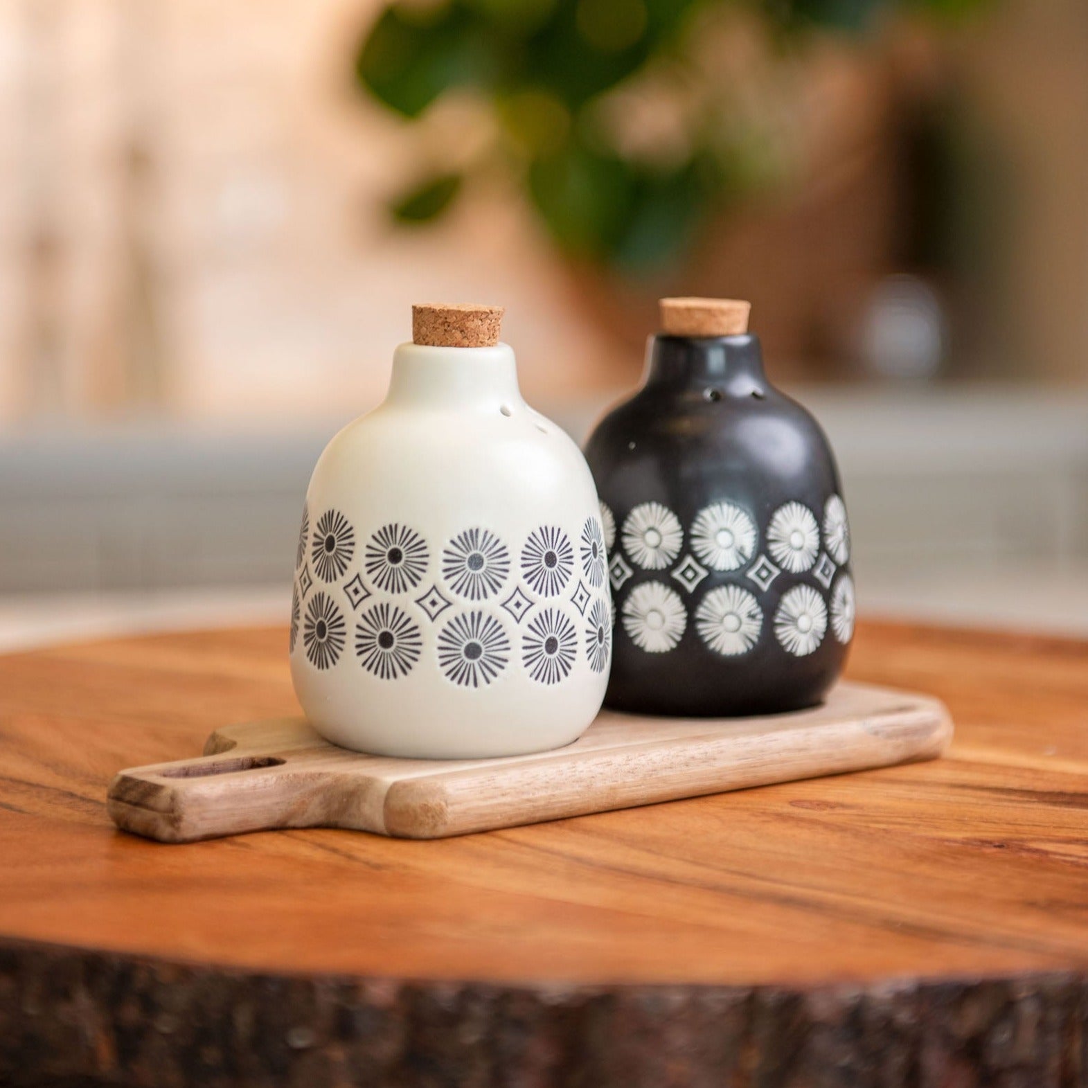 Milo Salt & Pepper With Wood Tray on a table.