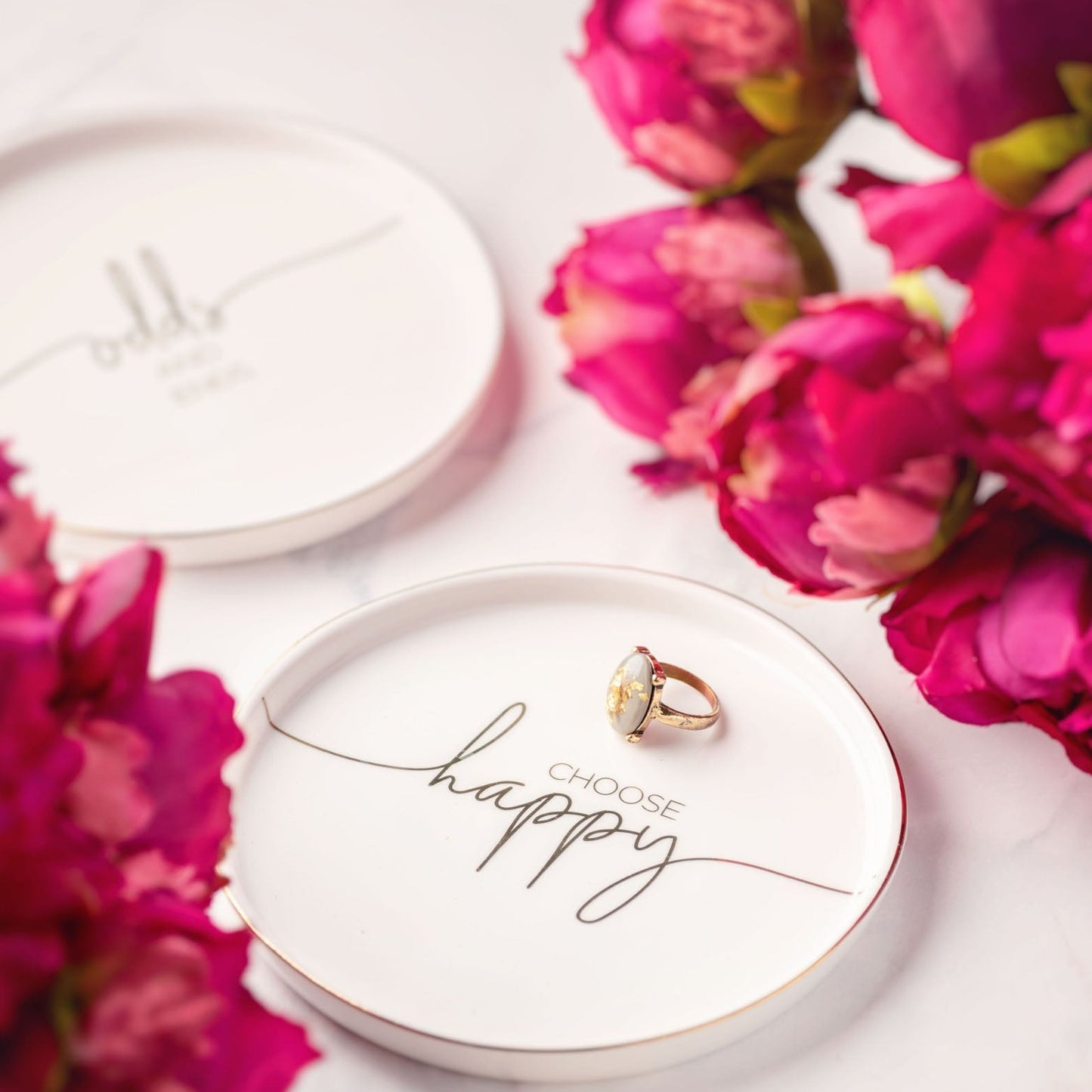 Sentiment trinket trays with flowers.