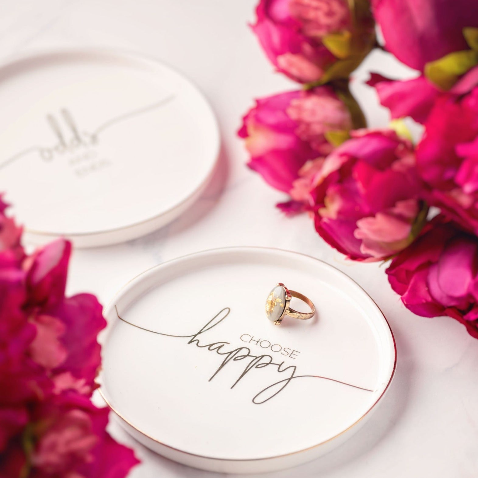 Sentiment trinket trays with flowers.