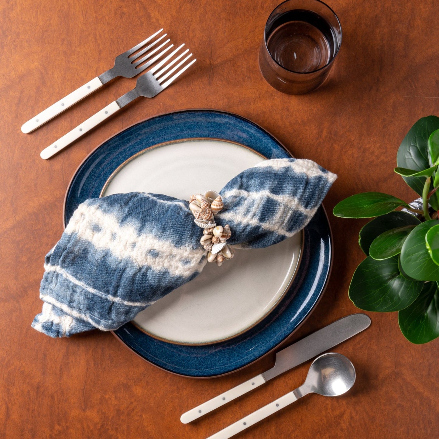 High Tide Tie Dye Dinner Napkins on a table setting.