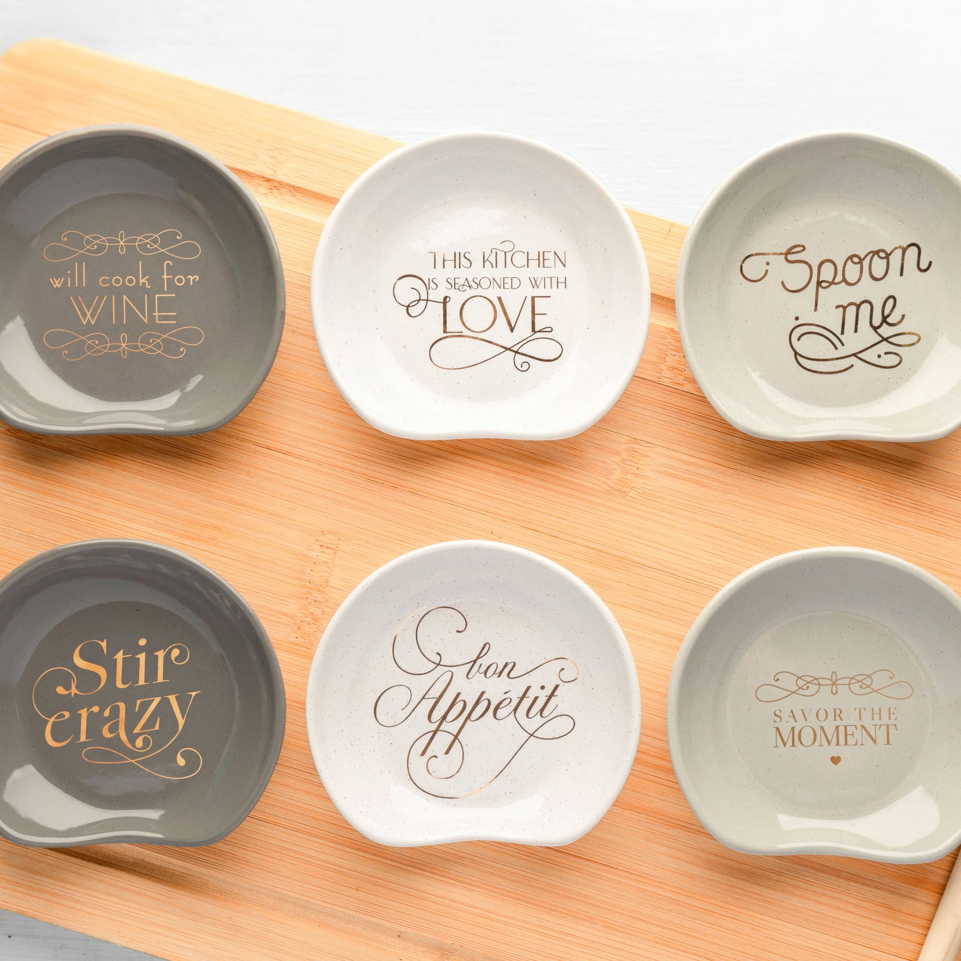 Chic Spoon Rests on a cutting board.