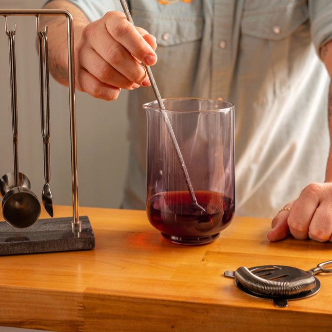 Luster Lexi Mixing Glass on a table with barware.