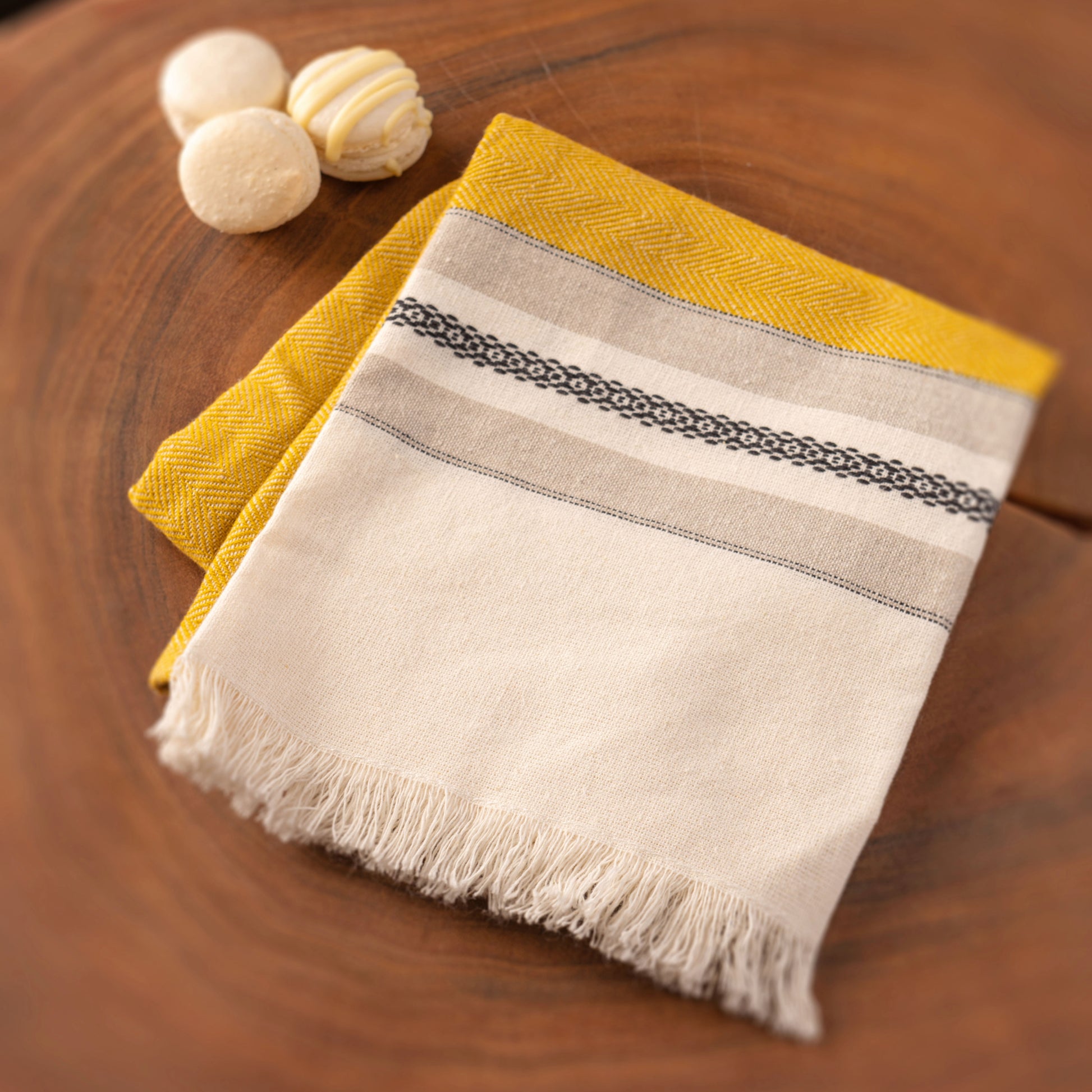 Ochre lisbon tea towel with macarons.