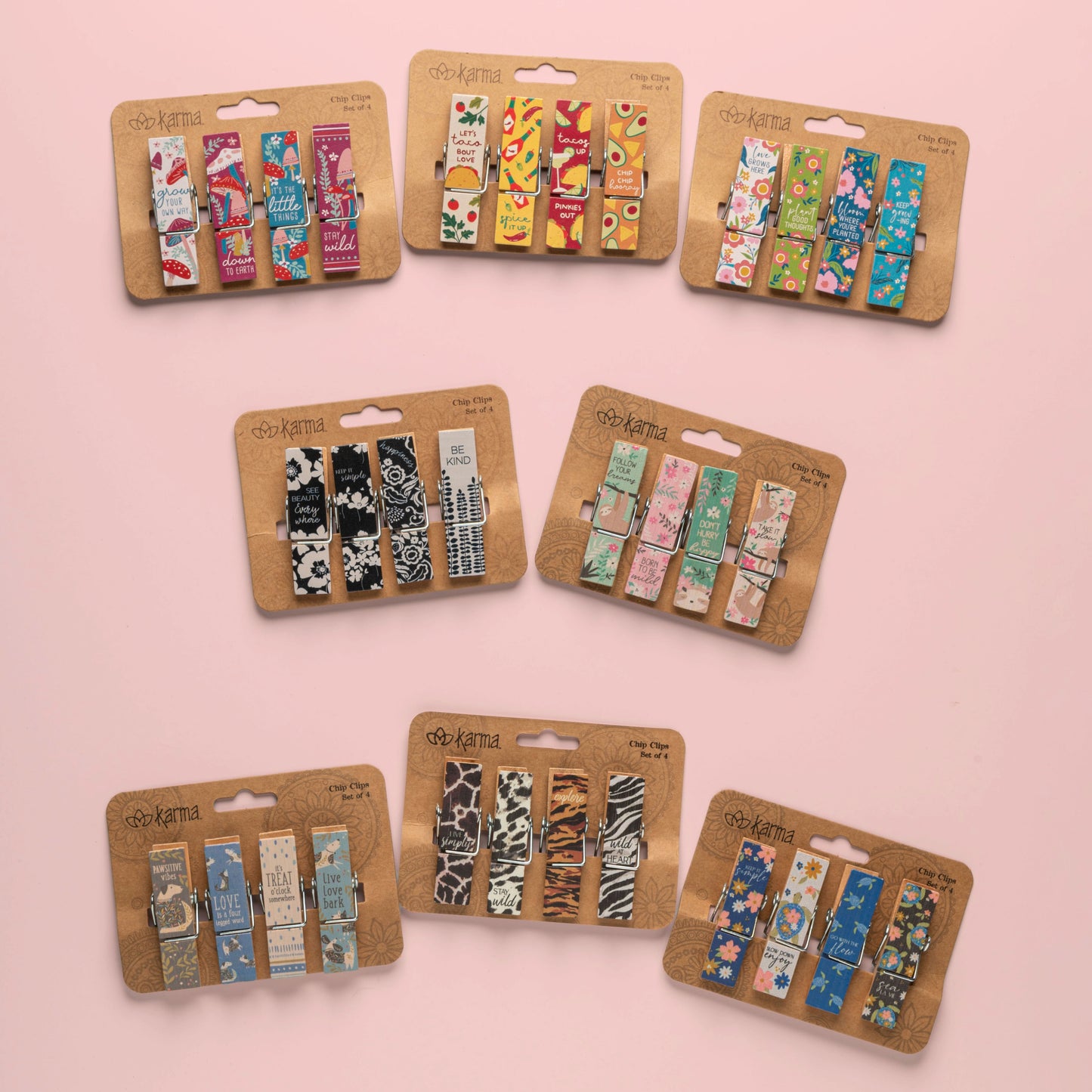 8 sets of chip clips against a pink background.