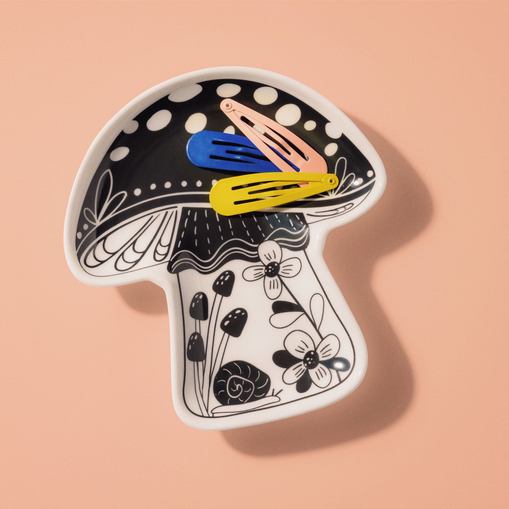 Mushroom Boho Shaped Trinket Tray with pink background. 