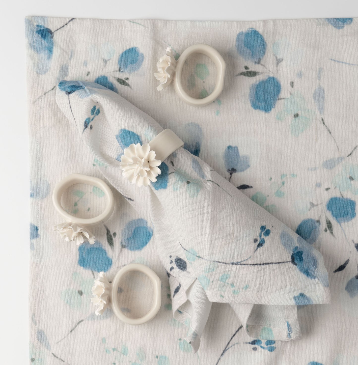 Ceramic Flower Napkin Rings on a napkin. 