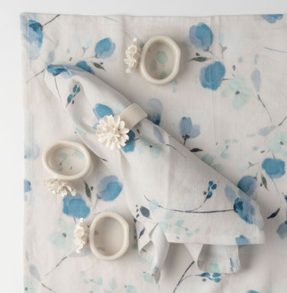 Ceramic Flower Napkin Rings on a napkin. 