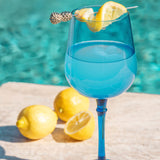 Isla wine glass with lemons and by the pool. 