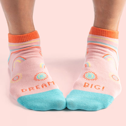 Dream Big Ankle Socks against a pink background. 