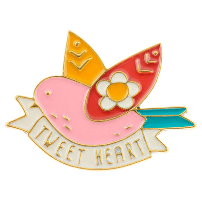 Bird enamel pin front view. 