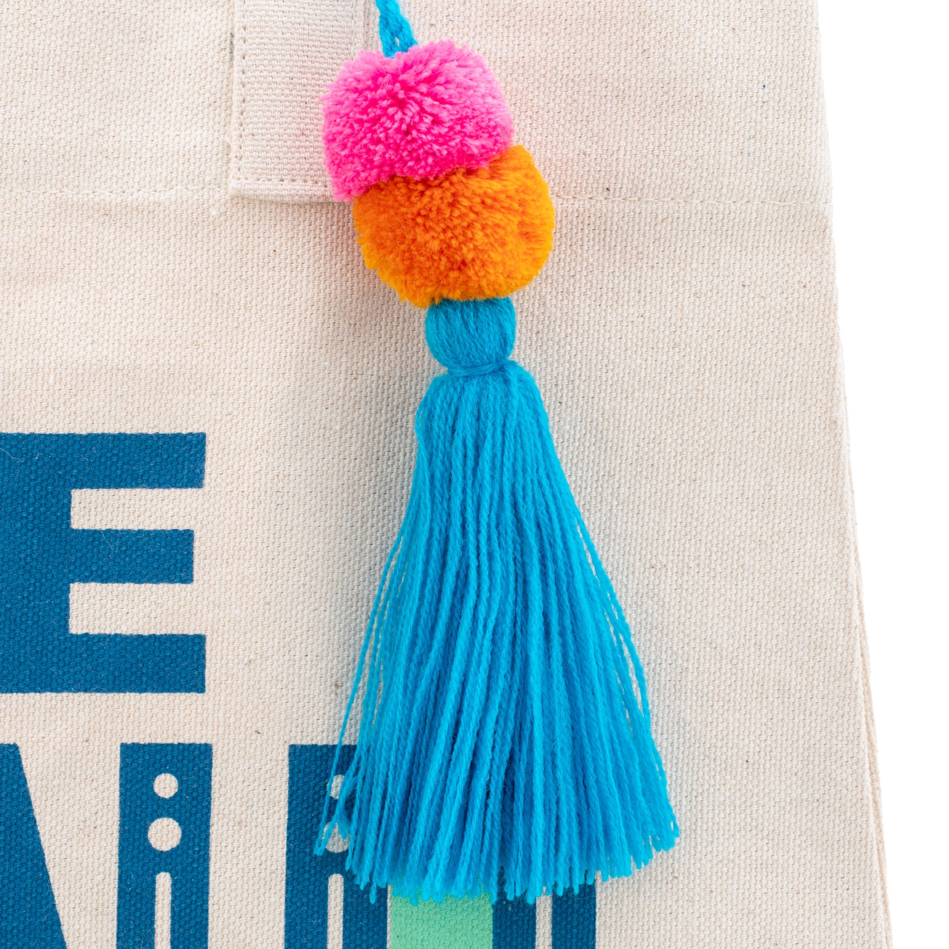 Be Kind Canvas Tote Bag close-up tassel view. 