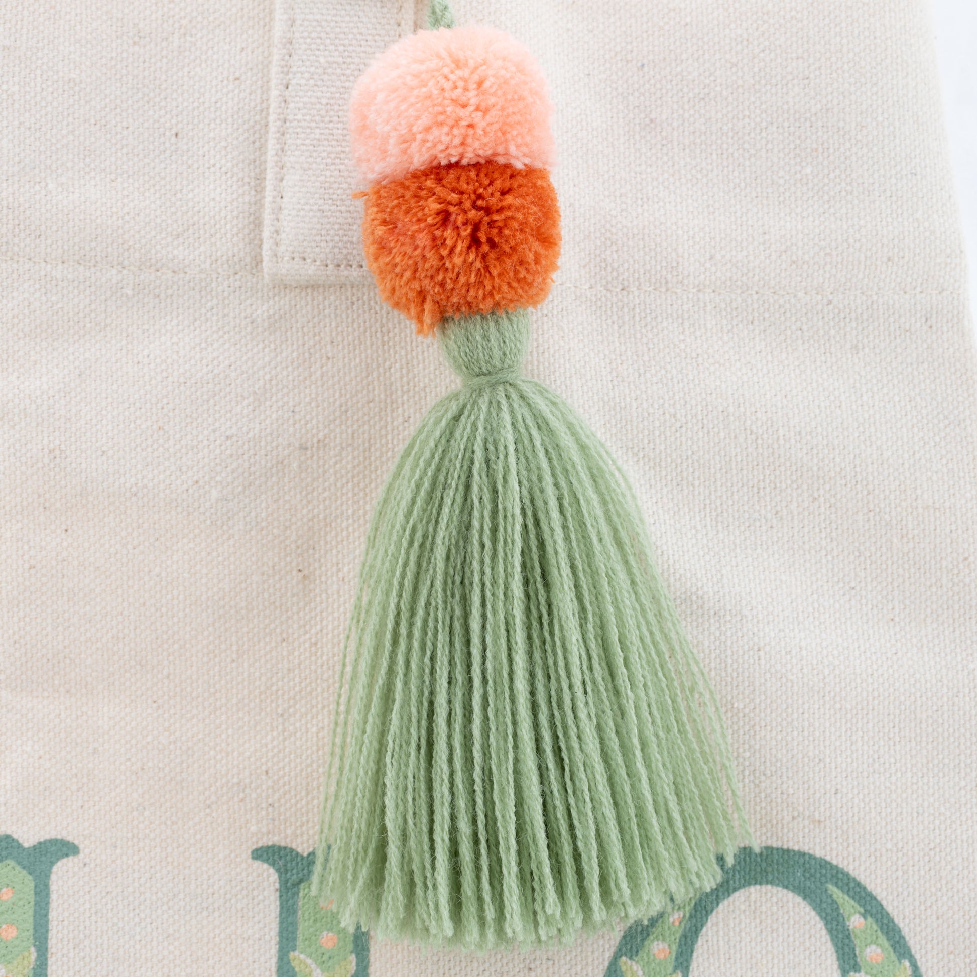 Hello Sunshine Canvas Tote Bag close-up tassel view. 
