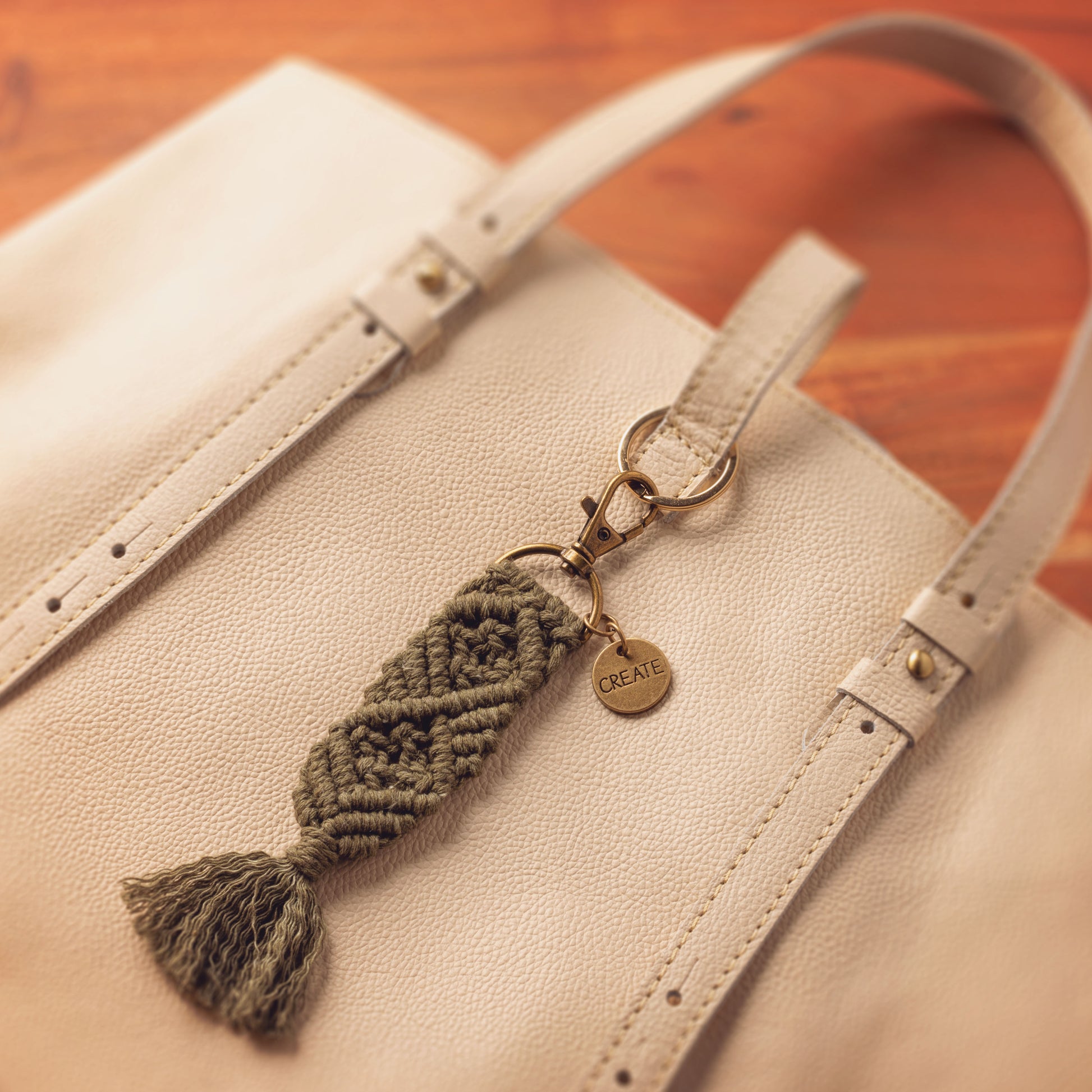 Create Macrame Keychain clipped on a bag. 