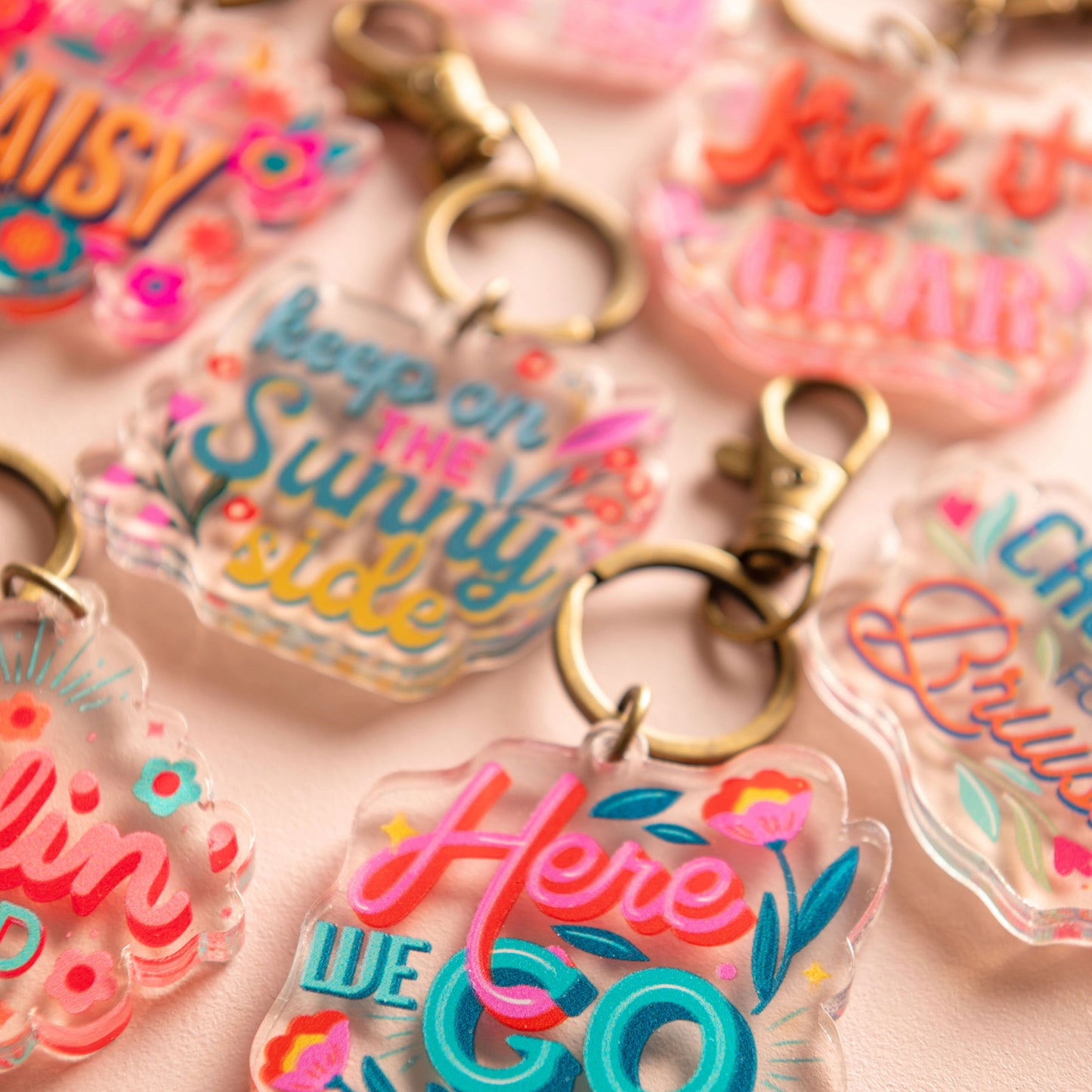 Acrylic keychains on a white table. 