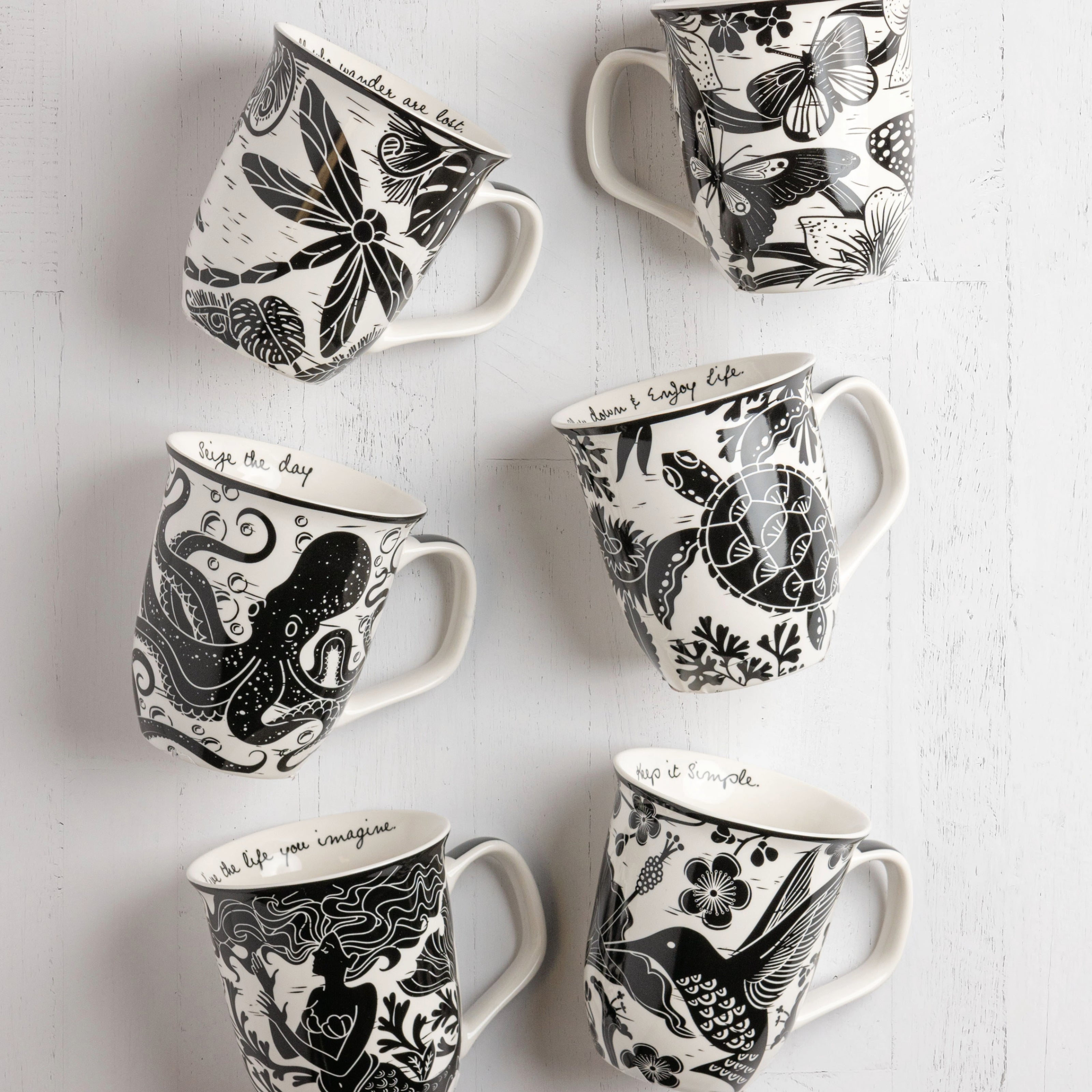 Boho mugs against a white background. 
