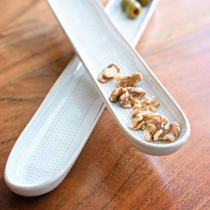 Mason Trays on a table with nuts and olives. 