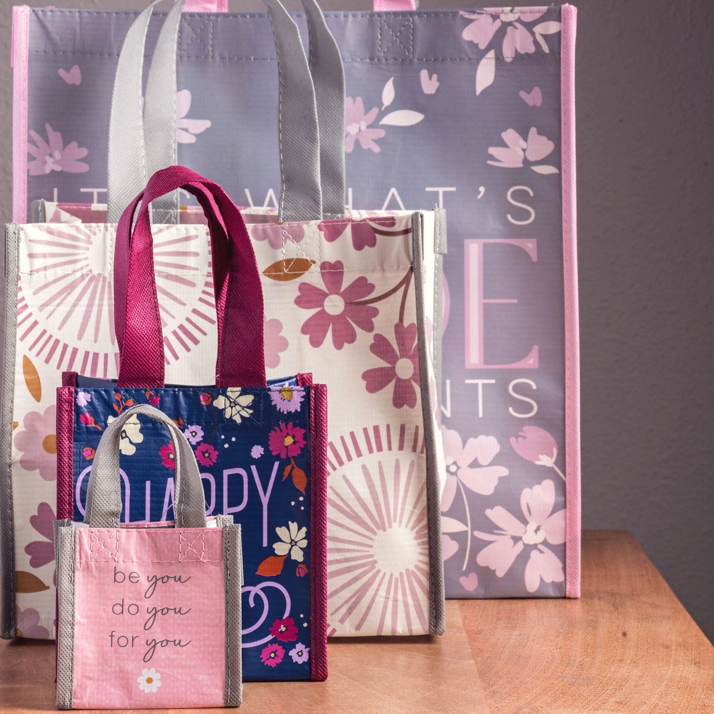 Recycled Medium Gift Bags stacked on a table. 