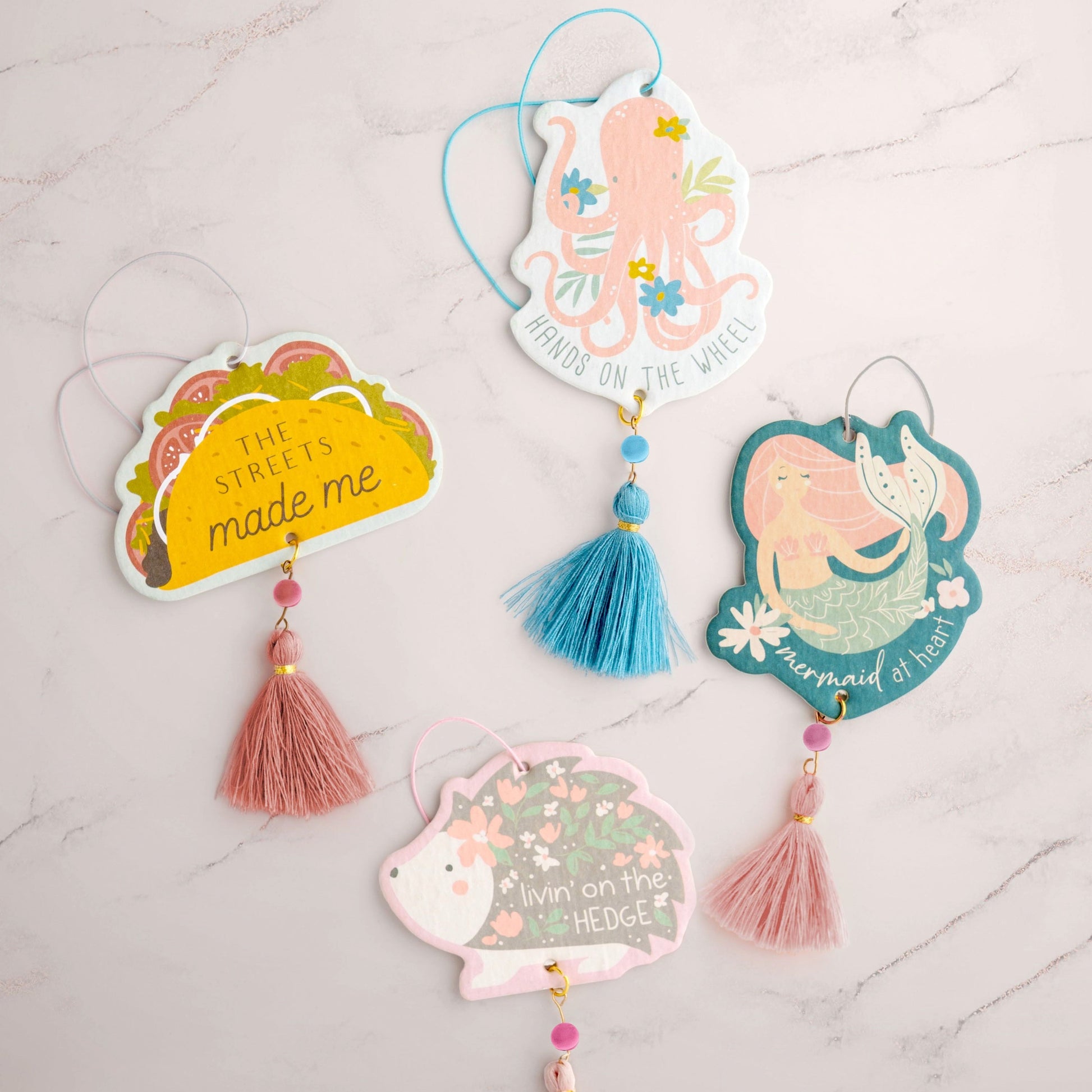 Shaped air fresheners on a marble counter top