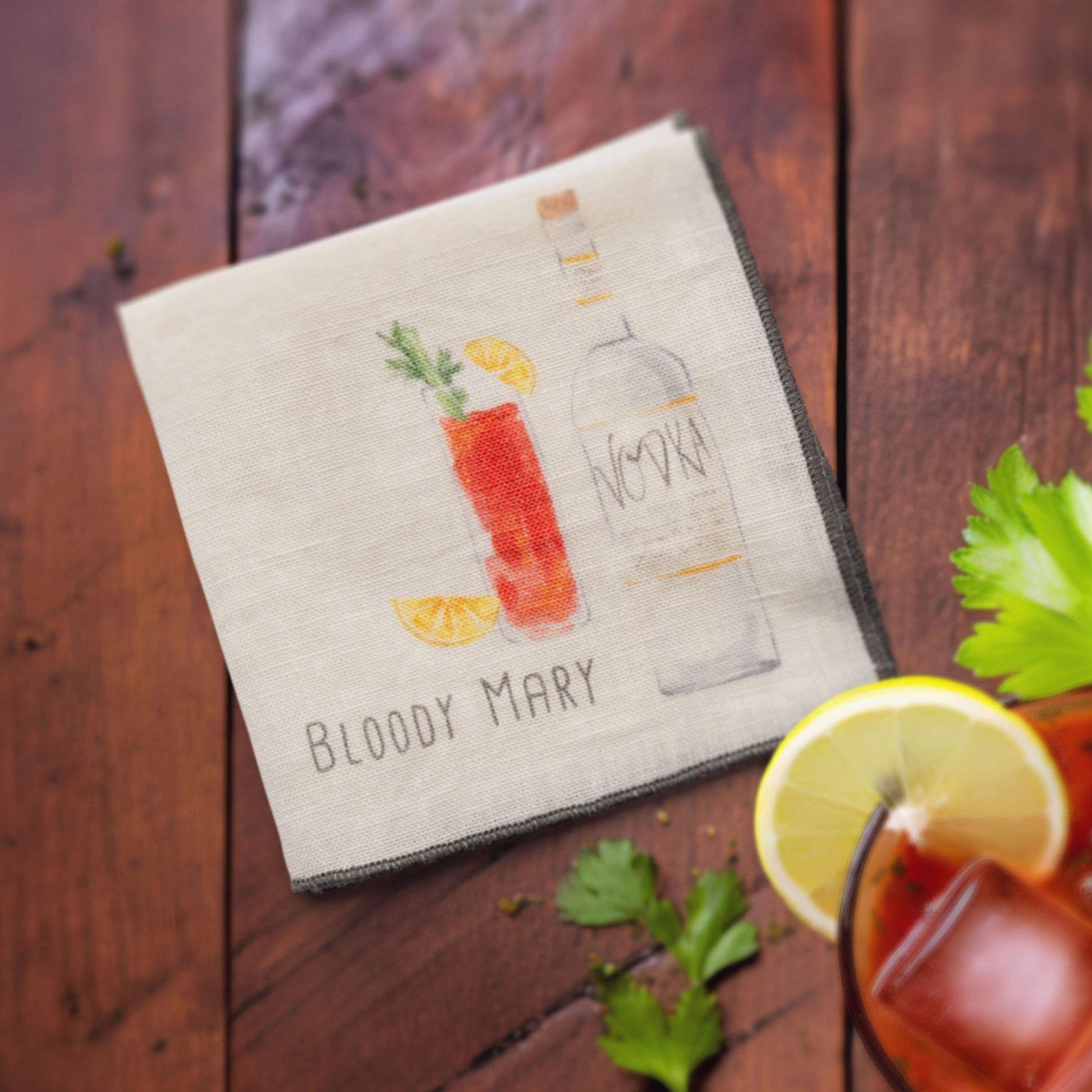 Speakeasy Linen Cocktail Napkins blood mary napkin on a table. 
