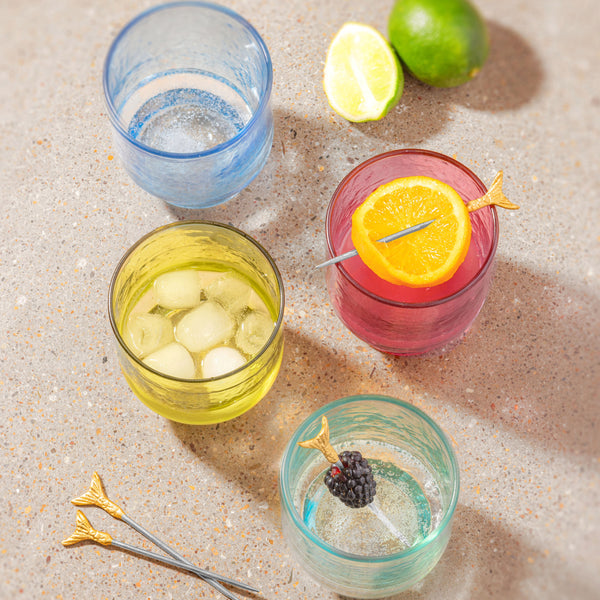 Catalina glasses on a counter with limes and cocktail picks