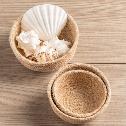 Natural Woven Mini Bowls with shells on a table. 